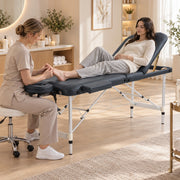 Therapist treating the feet of a client with the backrest raised