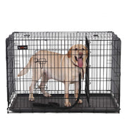 Front view of the black dog crate with a Labrador standing inside and the end door open