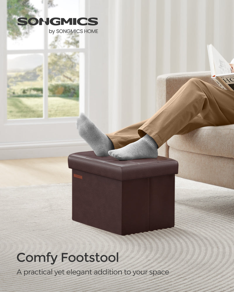 Man resting his feet on the chestnut brown footstool in a bright living room