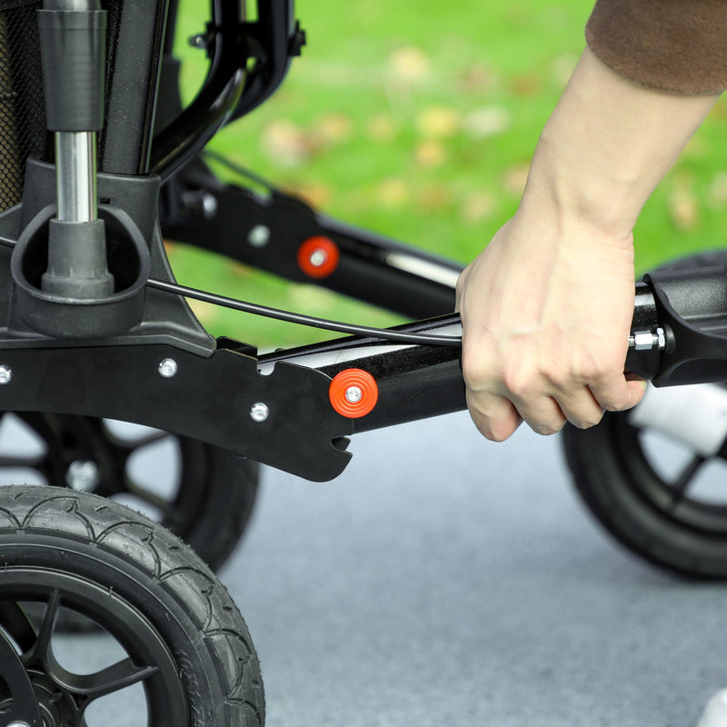 Close-up of a hand gripping the frame's folding hinge and quick-release hardware