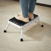 Feet on the step stool platform labelled 38 cm wide by 26 cm deep