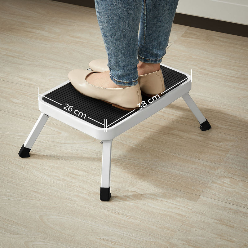 Feet on the step stool platform labelled 38 cm wide by 26 cm deep