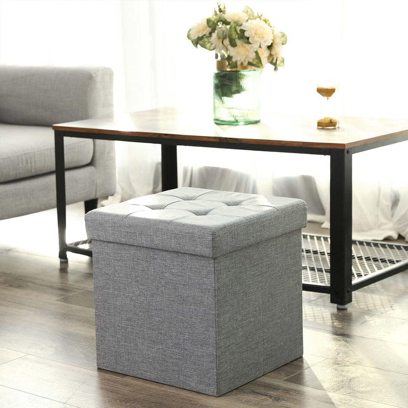 Light grey cube tucked under a coffee table in a bright living room