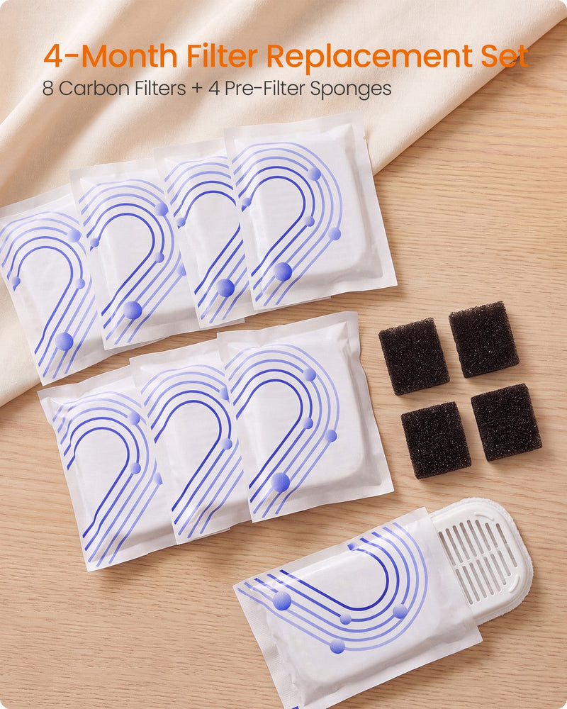 Sealed filter packs and four black sponges on a wooden surface in a 4-month replacement set