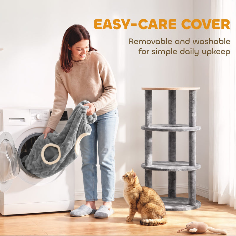 Removable plush cover being loaded into a washing machine next to the bare cat tower frame