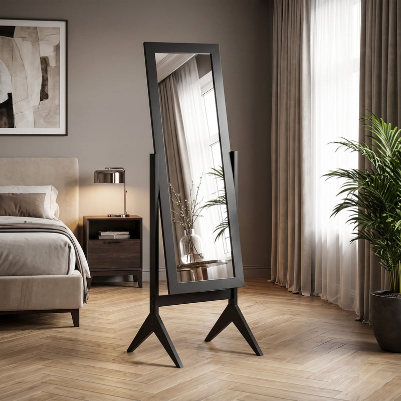 Freestanding mirror styled in a bedroom beside a nightstand and curtains