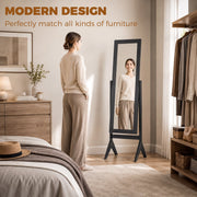 Freestanding mirror styled beside an open wardrobe