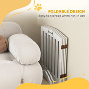 Dog gate folded flat for storage beside a sofa