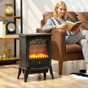 Electric stove fireplace beside a leather armchair as a woman reads a book