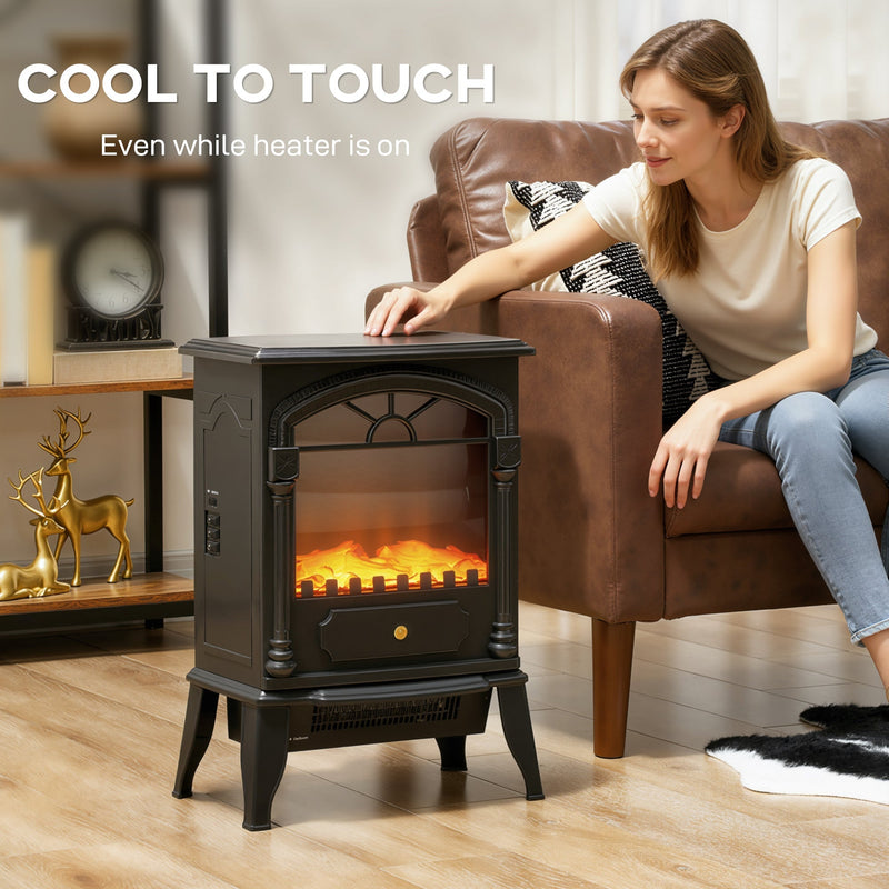 Woman leaning from her armchair to touch the top of the running heater