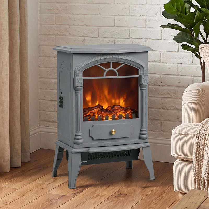 Electric stove fireplace standing against a painted brick wall beside an armchair