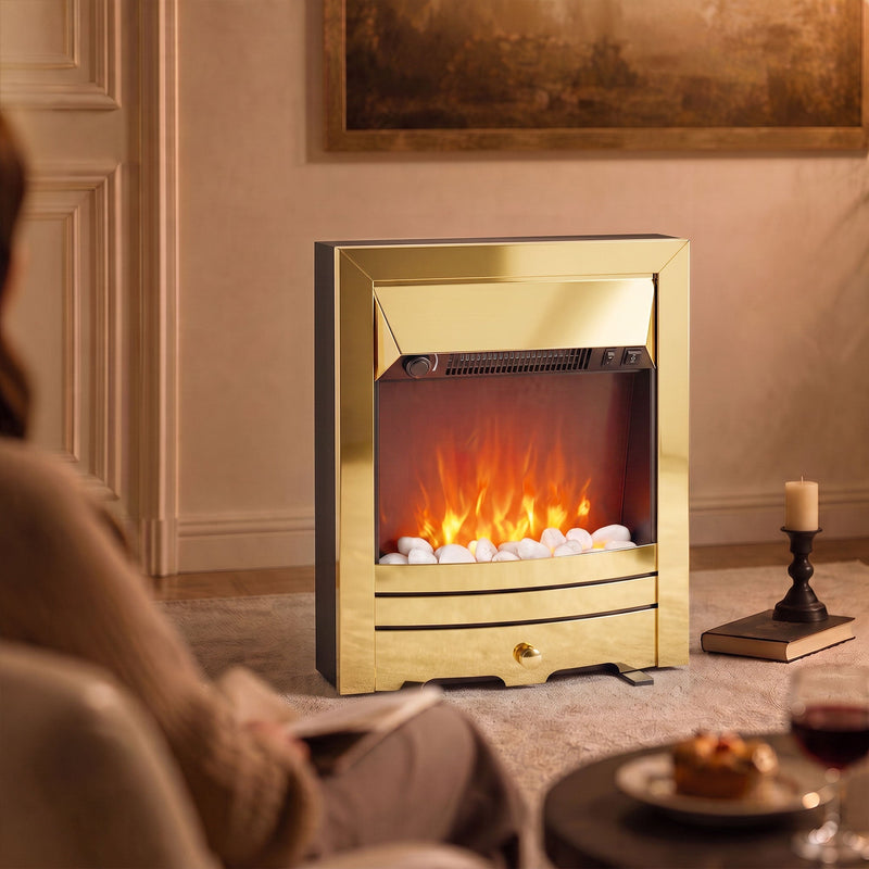 Glowing fireplace on a rug in an evening living room with a candle and dessert