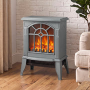 Grey electric fireplace stove glowing against a white brick wall in a modern living room