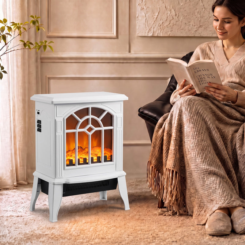 White electric fireplace stove glowing beside an armchair while a woman reads in a cosy living room