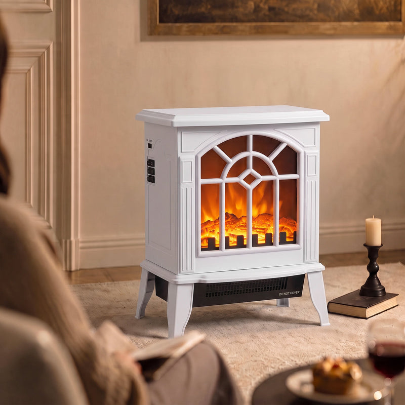 White electric fireplace stove lit in a living room beside a candle and coffee table, viewed from an angle