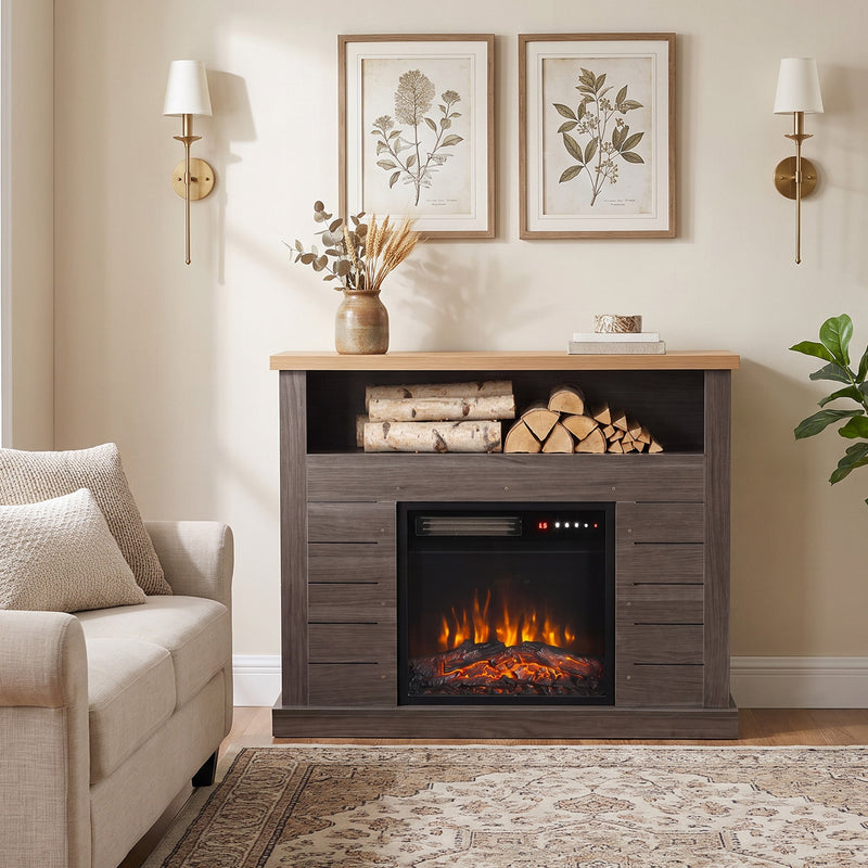 Fireplace suite beside a sofa with wall lights and framed prints above