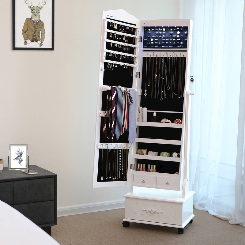 White jewellery armoire open in a bedroom, filled with necklaces, rings and scarves