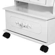 Close-up of the carved rose detail on the base drawer and the black castors