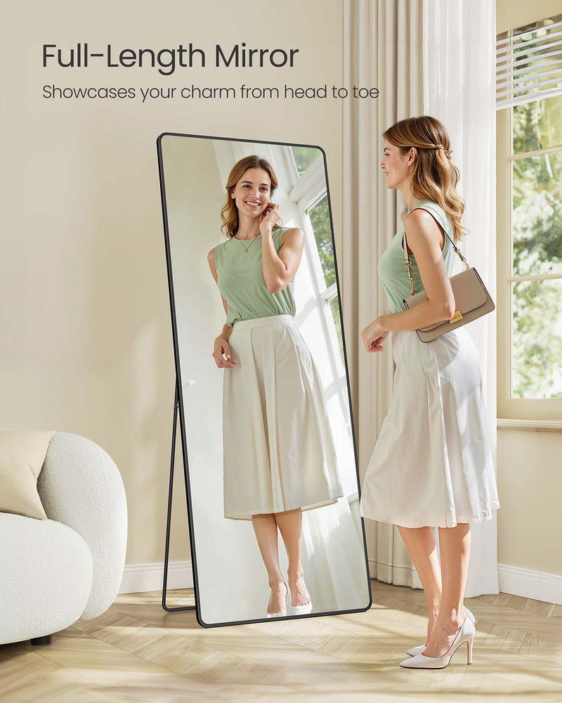 Full-length mirror freestanding in a bedroom setting