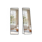 Two views of the black full-length mirror, one flat for wall mounting and one leaning on its fold-out stand