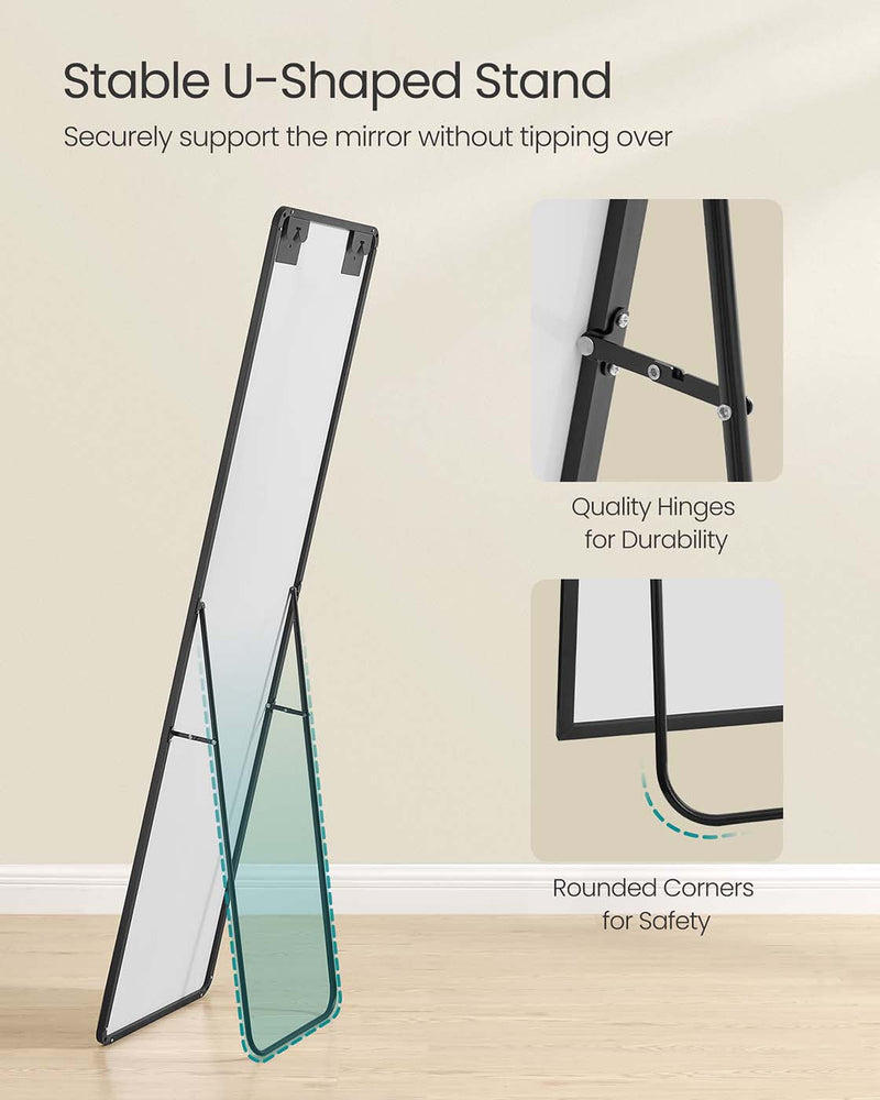 The mirror propped on its U-shaped stand with insets of the metal hinge and the rounded bottom corner