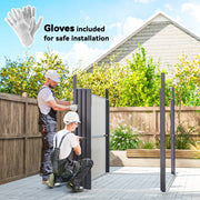 Two people assembling the metal shed panels in a garden with the included gloves
