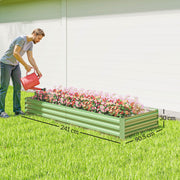Man watering flowers in the light green raised garden bed, marked 241 cm long and 30 cm high
