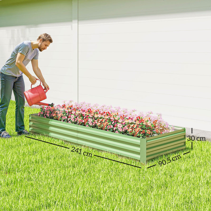 Man watering flowers in the light green raised garden bed, marked 241 cm long and 30 cm high