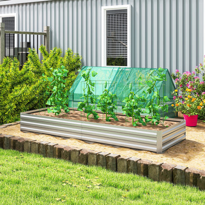 Silver galvanised steel raised garden bed with a plant cover and tomato plants on a lawn
