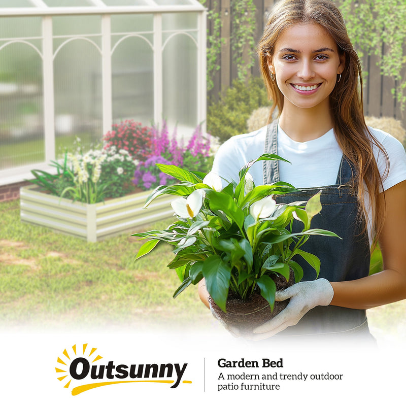 Gardener holding a potted plant beside the Outsunny garden bed