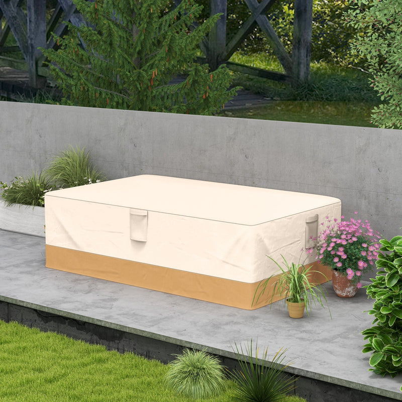 Beige furniture cover over a garden set on a patio beside a stone wall