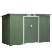 Pale green shed angled studio view with the sliding doors closed