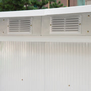 Close-up of two louvred vents above a cream corrugated wall panel