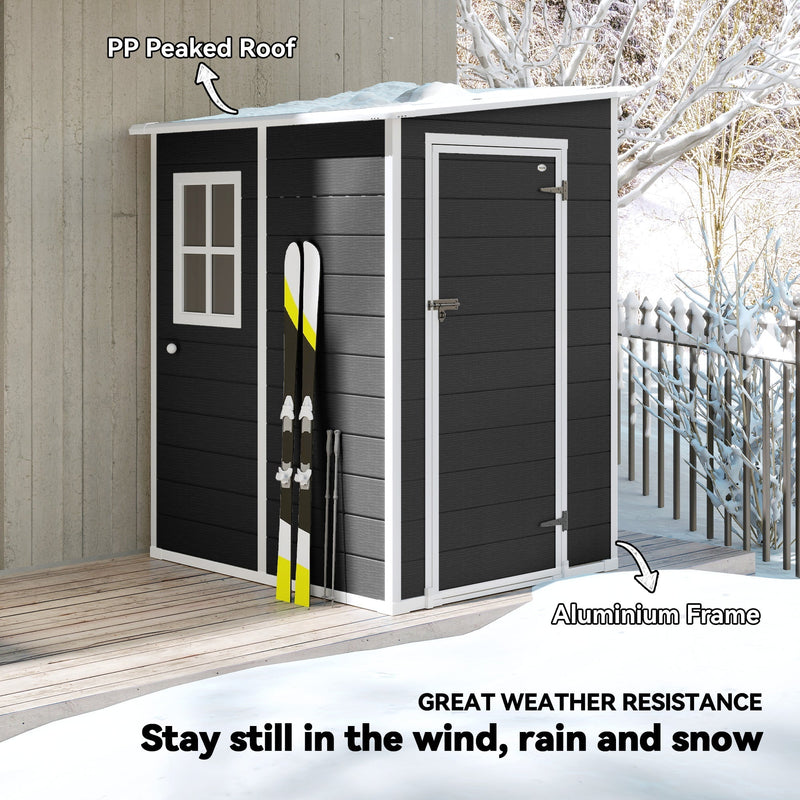 Shed in a snowy garden with skis leaning against it, labelling the aluminium frame and PP roof