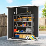 Straight-on view of the open shed with a steel shelving unit holding tool boxes and a leaf blower