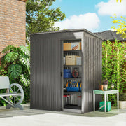 Light grey metal shed on a patio with its sliding door open showing stored tools