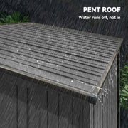 Close-up of the pent roof running rainwater off the edge of the shed