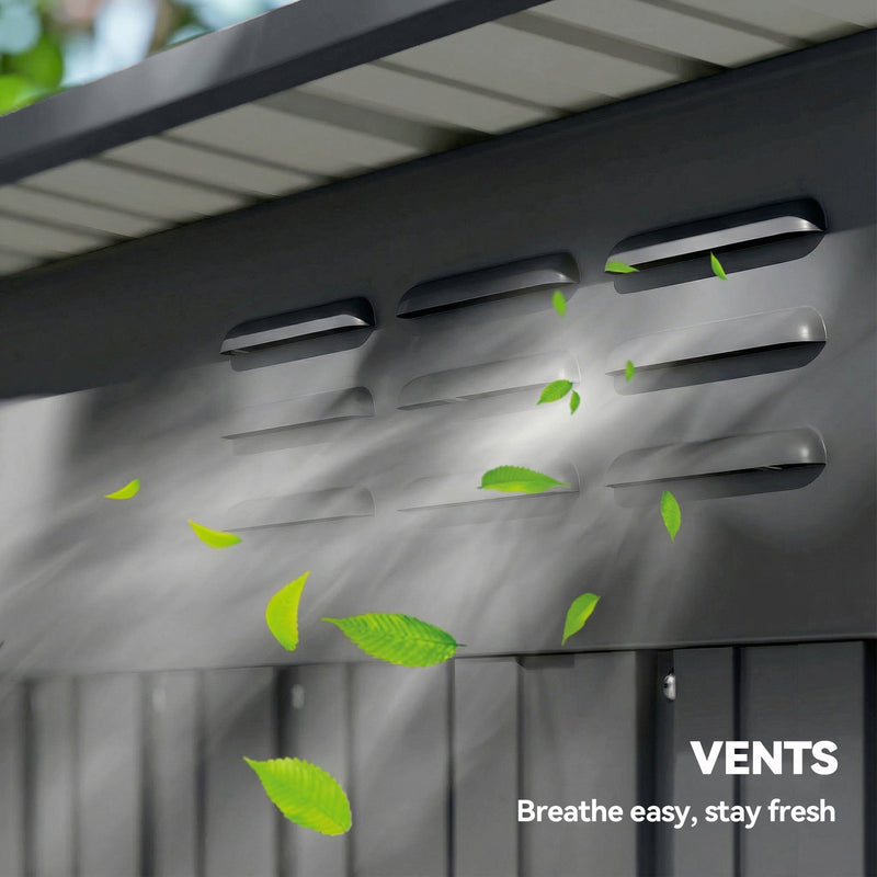 Close-up of the roof vent slots on the shed with leaves blowing past