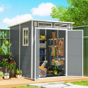 Pent-roof grey shed on decking with doors open showing shelving, baskets and tools