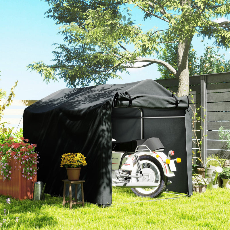 Dark grey storage tent on a lawn with a motorbike parked inside