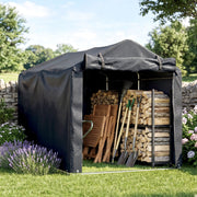 Dark grey storage tent in a garden holding stacked firewood and garden tools