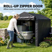 Woman wheeling a wheelbarrow of crates into the black tent through the roll-up zipper door