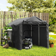 Black storage tent in a garden with a lawn mower and potted plants at the entrance