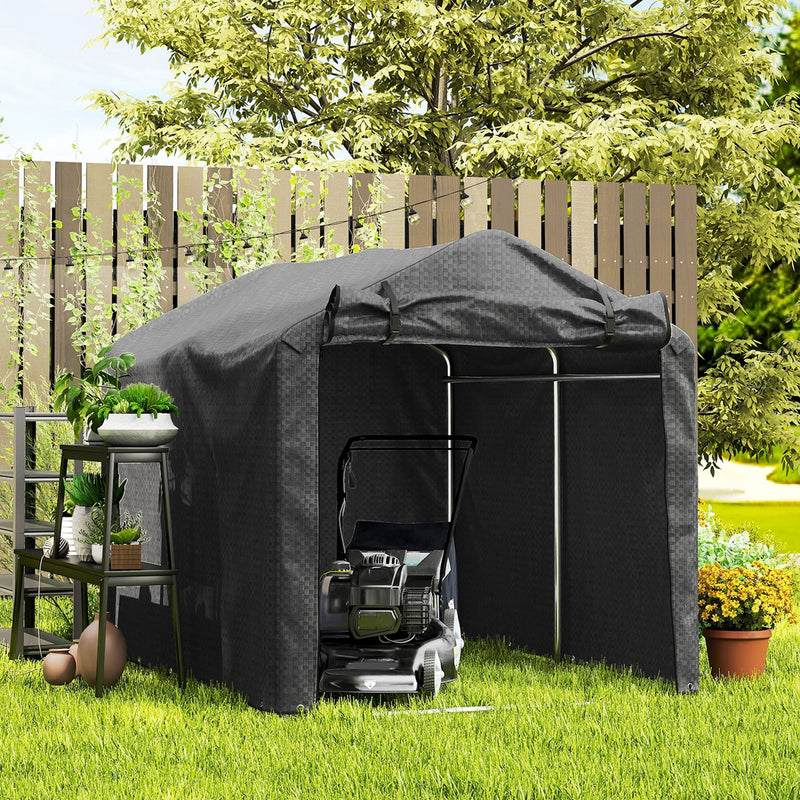 Black storage tent in a garden with a lawn mower and potted plants at the entrance