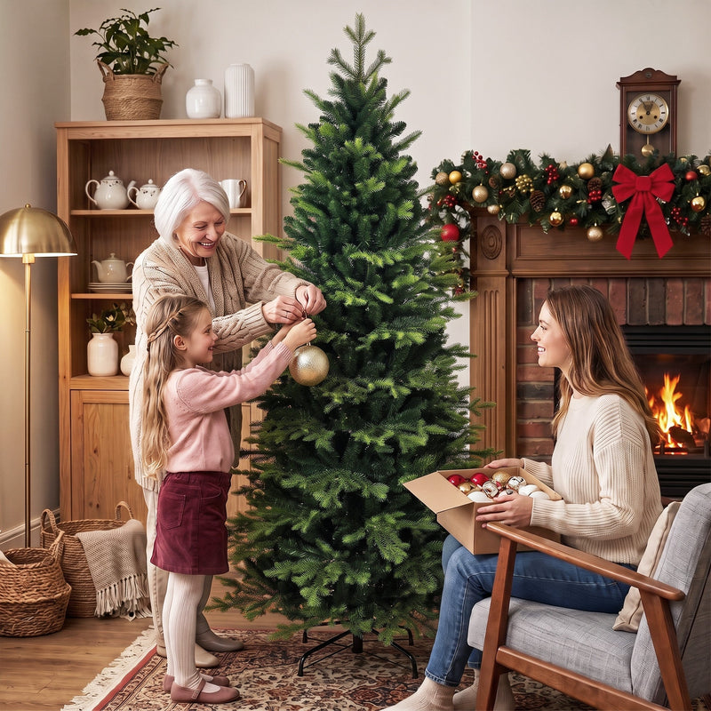 Grandmother and girl decorating the tree while a woman unpacks baubles nearby