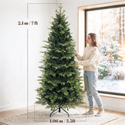 Dimensions of the 7ft Geneva fir tree: 2.1 m high and 1.06 m wide, with a woman beside it