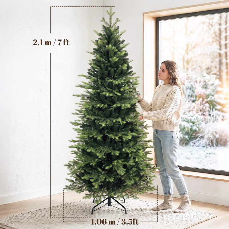 Dimensions of the 7ft Geneva fir tree: 2.1 m high and 1.06 m wide, with a woman beside it
