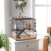 Gerbil cage with glass base placed on a cabinet in a bright living room