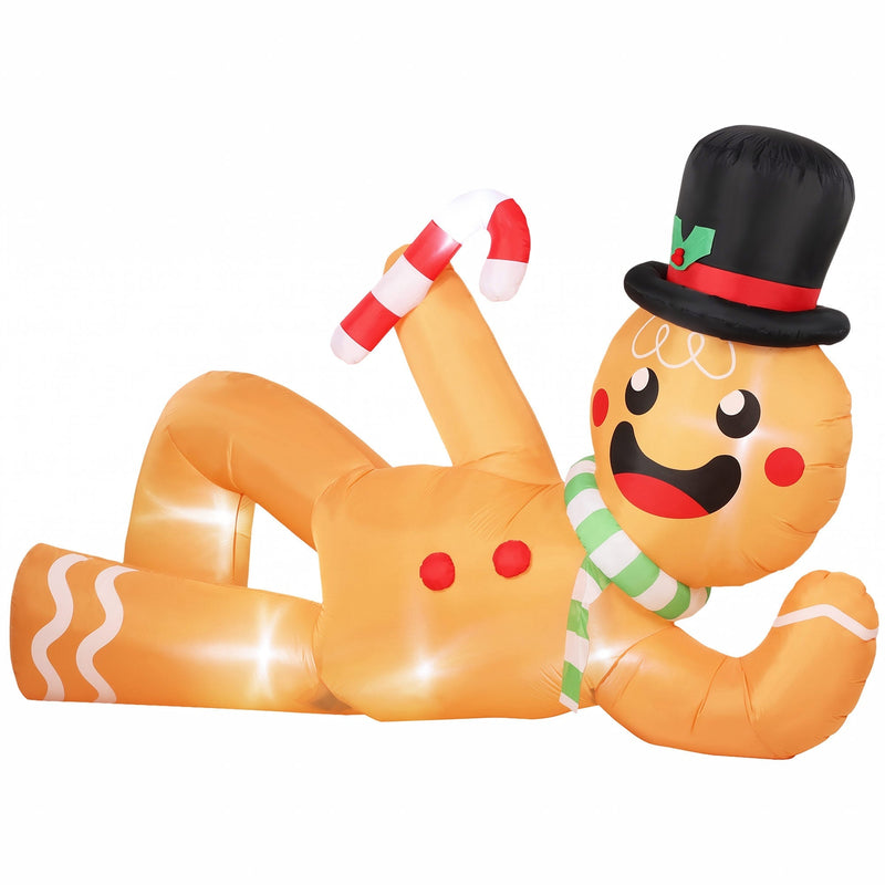 Light brown inflatable gingerbread man lying on its side holding a candy cane, white studio shot
