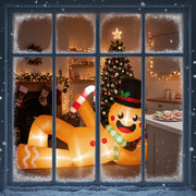 Gingerbread man glowing behind a frosted window beside a Christmas tree